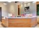 Modern community reception area with wood paneled desk and 'Skye Canyon' logo at 10699 Sariah Skye Ave, Las Vegas, NV 89166