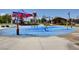 A colorful splash pad offers Gathering fun with sprayers and shade from the hot sun at 10699 Sariah Skye Ave, Las Vegas, NV 89166