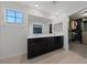 Bathroom featuring dual sinks, wood-look tile, and a walk-in closet at 120 Campbelltown Ave, Henderson, NV 89015