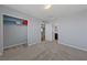 Neutral bedroom with grey walls and carpet, featuring a walk-in closet and ensuite bathroom at 120 Campbelltown Ave, Henderson, NV 89015