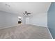 Open bedroom with neutral carpet, ceiling fan, and soft gray walls at 120 Campbelltown Ave, Henderson, NV 89015