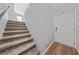 Inviting foyer with a staircase and hardwood floors leading to a bright, welcoming space at 120 Campbelltown Ave, Henderson, NV 89015