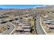 Expansive aerial view capturing the neighborhood layout and home exteriors in a Primary-planned community at 12422 Tudor Arch Dr, Las Vegas, NV 89138