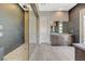 Elegant bathroom featuring a glass-enclosed shower with dual shower heads and tile surround at 12422 Tudor Arch Dr, Las Vegas, NV 89138