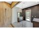 Contemporary bathroom with glass shower, dual vanities, and private outdoor access at 12422 Tudor Arch Dr, Las Vegas, NV 89138