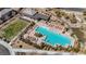 An aerial view of the community pool showing lounge seating, shade structures, and a large pool at 12422 Tudor Arch Dr, Las Vegas, NV 89138