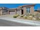 Beautiful single-Gathering home with a spacious garage and desert-friendly landscaping at 12422 Tudor Arch Dr, Las Vegas, NV 89138