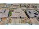 An aerial shot showcases the home's modern elevation, two-car garage, and desert landscaping at 12422 Tudor Arch Dr, Las Vegas, NV 89138