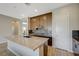 Beautiful kitchen featuring a large island with stone countertop and wooden cabinets at 12422 Tudor Arch Dr, Las Vegas, NV 89138