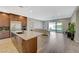 Modern kitchen overlooking living area and outdoor patio with stainless steel appliances at 12422 Tudor Arch Dr, Las Vegas, NV 89138