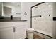 Bathroom featuring a marble-tiled walk-in shower with black trim and modern fixtures at 1254 Melville Dr, Las Vegas, NV 89102