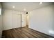 Bright bedroom featuring wood-look flooring, recessed lighting, closet, and a neutral color palette at 1254 Melville Dr, Las Vegas, NV 89102