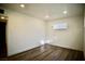 Bedroom showcasing wood-look floors, recessed lighting, and a window with natural light at 1254 Melville Dr, Las Vegas, NV 89102