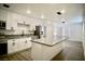 Bright kitchen featuring white cabinets, an island, and stainless steel appliances at 1254 Melville Dr, Las Vegas, NV 89102