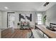 Open concept dining area featuring a wooden table with bench seating, modern decor, and lots of light at 1800 Edmond St # 215, Las Vegas, NV 89146