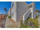 Exterior of home with concrete walkway, stucco siding, and decorative shrubs at 1800 Edmond St # 215, Las Vegas, NV 89146