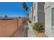 Exterior walkway alongside neutral toned home and drought resistant landscaping at 1800 Edmond St # 215, Las Vegas, NV 89146