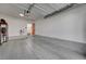 Spacious garage with an electric car charger and a doorway to the exterior at 1800 Edmond St # 215, Las Vegas, NV 89146