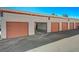 Row of garages each featuring a roll up door and convenient access at 1800 Edmond St # 215, Las Vegas, NV 89146