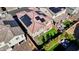 A high-angle shot showcases a tile roof adorned with solar panels and a neatly turfed backyard at 183 Baru Belin Ave, Las Vegas, NV 89183