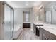 Open bathroom layout featuring a glass shower, soaking tub, dual vanities, and wood-look flooring at 183 Baru Belin Ave, Las Vegas, NV 89183