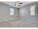 Neutral bedroom filled with natural light from the windows, and features a ceiling fan at 183 Baru Belin Ave, Las Vegas, NV 89183