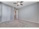 Bright bedroom with closet doors and a ceiling fan is carpeted for comfort at 183 Baru Belin Ave, Las Vegas, NV 89183