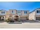 Charming two-story home with a well-manicured front yard and a two-car garage at 183 Baru Belin Ave, Las Vegas, NV 89183