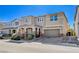 Inviting two-story home featuring a covered porch, neutral exterior paint, and attached garage at 183 Baru Belin Ave, Las Vegas, NV 89183