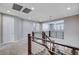 Bright hallway with modern railing and an open view to the living area at 183 Baru Belin Ave, Las Vegas, NV 89183