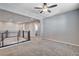 Carpeted hallway with modern railing and recessed lighting creates a bright, open space at 183 Baru Belin Ave, Las Vegas, NV 89183