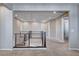 Well-lit hallway featuring modern railing and neutral color palette at 183 Baru Belin Ave, Las Vegas, NV 89183