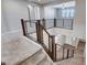 Second floor landing featuring modern metal railing and a view of the entry at 183 Baru Belin Ave, Las Vegas, NV 89183