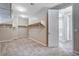 Spacious walk-in closet featuring carpeted floors, ample shelving, and a door leading to the Primary bathroom at 183 Baru Belin Ave, Las Vegas, NV 89183