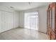 A bedroom featuring neutral walls, tile flooring, and a closet with bi-fold doors at 211 N Lamb Blvd # C, Las Vegas, NV 89110