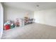 Bright living room with tile flooring and neutral walls, next to a sliding glass door at 211 N Lamb Blvd # C, Las Vegas, NV 89110