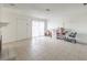 Bright living room with tile floors, neutral walls and a cozy fireplace with a sliding glass door at 211 N Lamb Blvd # C, Las Vegas, NV 89110