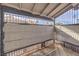 Covered patio featuring wrought iron railing with a view to the surrounding neighborhood, providing a relaxing outdoor space at 211 N Lamb Blvd # C, Las Vegas, NV 89110