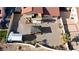 Aerial view of a backyard featuring a pergola, shed, and desert landscaping at 2111 River City Dr, Laughlin, NV 89029