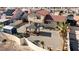 Aerial view of a spacious backyard featuring a pergola, shed, and desert landscaping at 2111 River City Dr, Laughlin, NV 89029