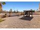 Wide backyard view with gazebo, offering an outdoor dining area and a shed, set in a spacious landscaped environment at 2111 River City Dr, Laughlin, NV 89029