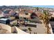 Aerial view of a backyard featuring a pergola, shed, and desert landscaping at 2111 River City Dr, Laughlin, NV 89029