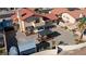 Aerial view of a backyard with a pergola, patio area, and desert landscaping at 2111 River City Dr, Laughlin, NV 89029