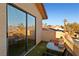 Balcony with table and chairs overlooking neighborhood at 2111 River City Dr, Laughlin, NV 89029