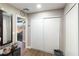 Bright bedroom featuring closet space, wood-look floors, and an open doorway to the balcony at 2111 River City Dr, Laughlin, NV 89029