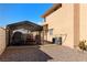 Carport adjacent to a home, providing covered parking or storage in the gravel backyard, offering added convenience at 2111 River City Dr, Laughlin, NV 89029