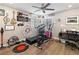 Bright exercise room featuring a ceiling fan, wood floors, and musical decor at 2111 River City Dr, Laughlin, NV 89029