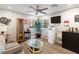 Cozy living room with hardwood floors, modern ceiling fan and plenty of natural light at 2111 River City Dr, Laughlin, NV 89029