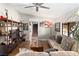 Bright living room featuring wood floors, comfortable seating, and a staircase at 2111 River City Dr, Laughlin, NV 89029