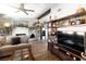 Inviting living room showcasing a fireplace, wood floors, and stylish shelving at 2111 River City Dr, Laughlin, NV 89029